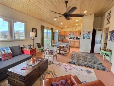 Spacious and inviting dining area and kitchen with sliding glass doors to patio