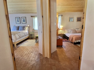 Hallway to Two Queen Bedrooms, Snuggle into Plush Bedding and Pillows.