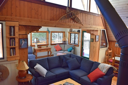 Living area couches and entertainment near the fireplace