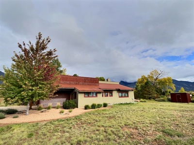 The front of the home, approaching from the road