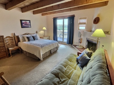 Queen bedroom with patio view