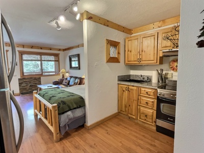 Kitchenette with apartment size oven/range and storage drawers and cabinets