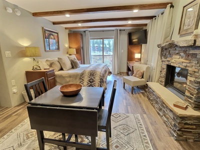 Dining room looks into sleeping area and porch