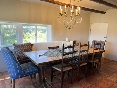 Formal dining area in formal living room. Door opens to the grilling and outdoor dining area.