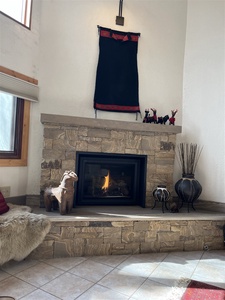 This incredible picture sandstone hearth is the centerpiece of the open living space.