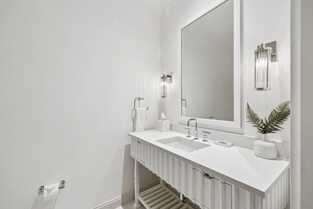 Freshen up in your private, elegantly designed bathroom featuring sleek fixtures, soft lighting, and a spa-like atmosphere for your ultimate relaxation.