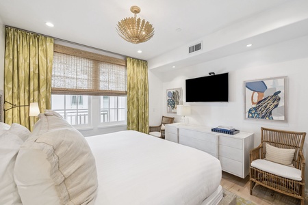 Rest peacefully in this elegantly appointed bedroom featuring premium linens, modern amenities, and sophisticated coastal-inspired decor.
