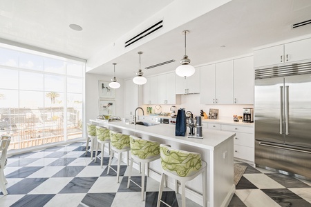 Whip up gourmet meals in your bright modern kitchen, complete with premium appliances and cheerful breakfast bar seating.