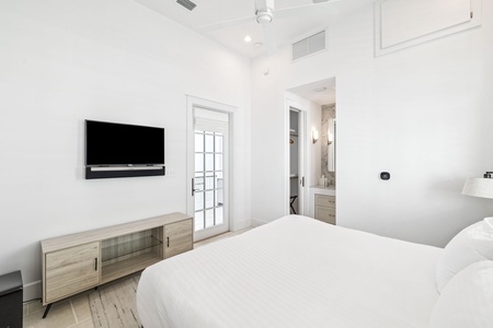 Relax in your bright, modern bedroom with premium linens, flat-screen TV, and ensuite bathroom for ultimate comfort.