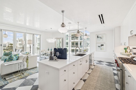 Your bright, modern kitchen flows seamlessly into the living space, with gleaming counters and ocean views inspiring your culinary adventures.