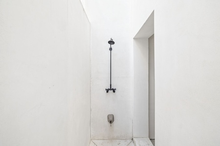 Step into your sleek, minimalist shower with modern fixtures and clean lines for a refreshing start to your day.