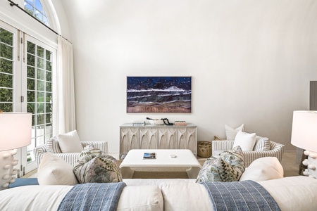Sink into plush sofas and let the natural light pour in through soaring windows, creating your perfect retreat for relaxation and conversation.