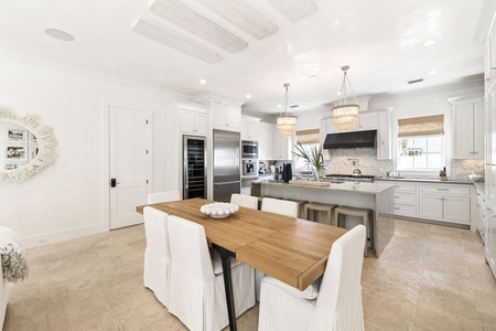 Your stunning gourmet kitchen awaits with marble countertops, professional appliances, and elegant dining space for memorable meals together.