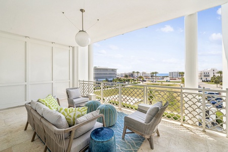 Unwind on your private balcony with plush seating and stunning city views that stretch to the horizon.