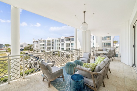 Unwind on your spacious balcony with plush seating and vibrant coastal décor, where morning coffee tastes better with neighborhood views.