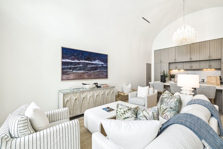Unwind in your bright, airy living space where coastal charm meets modern comfort. Soft textures, elegant arches, and thoughtful design create the perfect retreat for your getaway.