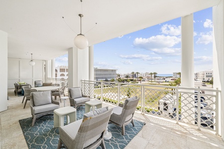 Relax on your expansive covered terrace with stylish seating and sweeping views of the cityscape and distant coastline.