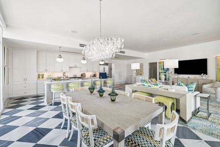 Gather around this stunning dining table where memorable meals and conversations await, perfectly positioned in your bright open-plan space.