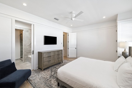 Rest in your serene master suite with crisp linens, modern entertainment, and an elegant ensuite bathroom just steps away.