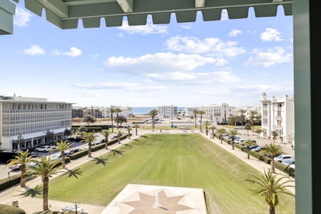 Expansive city views stretch from your private terrace, where palm-lined boulevards and modern architecture create a vibrant urban landscape beneath endless blue skies.