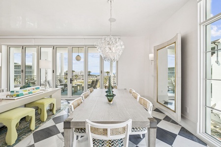 Your elegant dining space flows seamlessly to the terrace, where stunning city views create the perfect backdrop for memorable meals together.