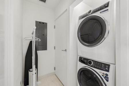 Your dedicated laundry area features a stacked washer and dryer, making it easy to pack light and keep your clothes fresh throughout your stay.