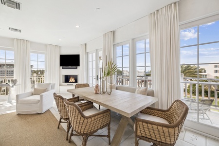 Relax in this bright dining space where coastal elegance meets comfort. Your meals become memorable moments with stunning views and a cozy fireplace.