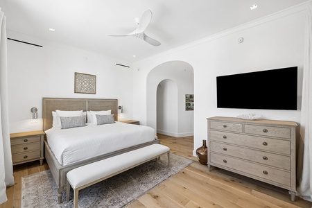 Unwind in your serene bedroom, where crisp white linens, warm wood furnishings, and a spacious layout create your perfect escape. Ceiling fan keeps you comfortable.