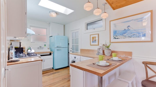 Kitchen space with washer/dryer and access to back patio