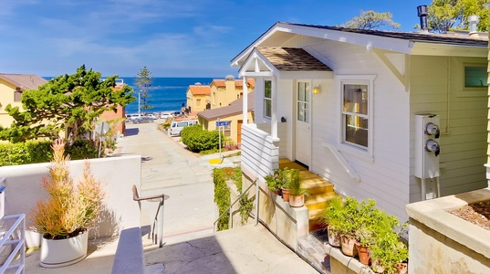 Home is located on a court connecting to the Village with an ocean view