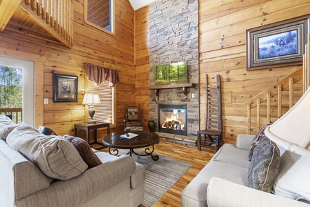 Cozy Living Room with High Ceilings and Fireplace
