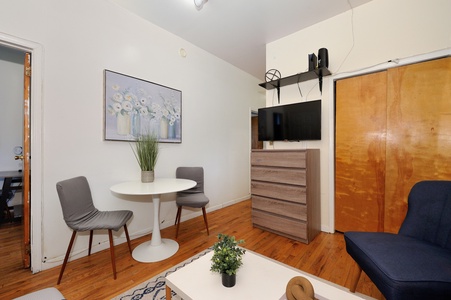 Your cozy retreat features warm hardwood floors and modern furnishings perfect for relaxing after exploring the city.