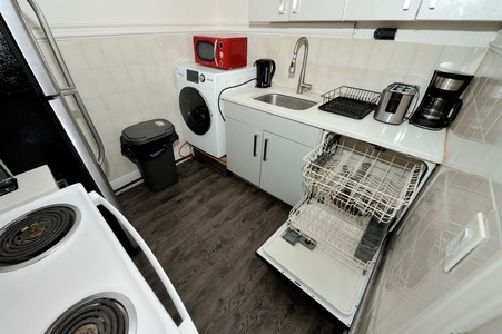 Your fully equipped kitchen has everything you need - dishwasher, microwave, coffee maker, and washer for ultimate convenience during your stay.