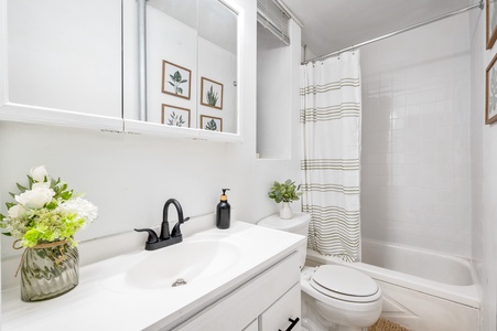 Your stylish bathroom features fresh botanicals and thoughtful touches, creating a spa-like retreat for your morning routine.