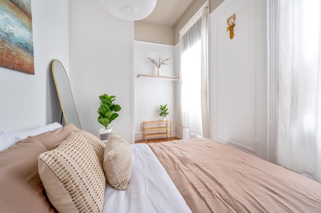 Wake up refreshed in your serene bedroom, where soft natural light filters through curtains and thoughtful details create perfect tranquility.