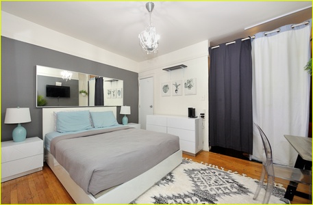 Sink into your comfortable bed surrounded by elegant chandeliers and modern touches that create the perfect retreat for your stay.