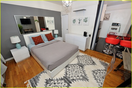 Relax in your modern studio with plush bedding, stylish décor, and a fully equipped kitchen—your perfect home away from home.