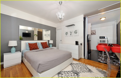 Your bright studio features a comfortable bed, fully equipped kitchen, and modern amenities for a perfect city escape.