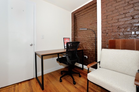 Your dedicated workspace features exposed brick walls and modern furnishings, creating an inspiring atmosphere for productivity.
