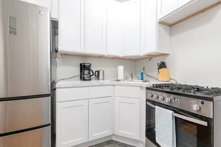 Your fully equipped kitchen features modern stainless steel appliances, ample counter space, and everything you need to prepare meals during your stay.