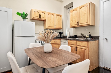 Your fully equipped kitchen makes meal prep a joy with warm wood cabinets, granite counters, and modern appliances.