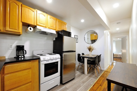 Your fully equipped kitchen makes dining in easy, with modern appliances and a cozy table perfect for morning coffee or intimate meals.