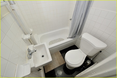 Your private bathroom features everything you need - a refreshing shower, clean toilet, and sink for your daily routines.
