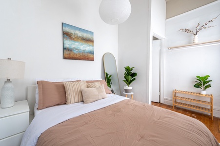 Drift into peaceful sleep in your serene bedroom, where soft linens and gentle lighting create the perfect sanctuary for rest.