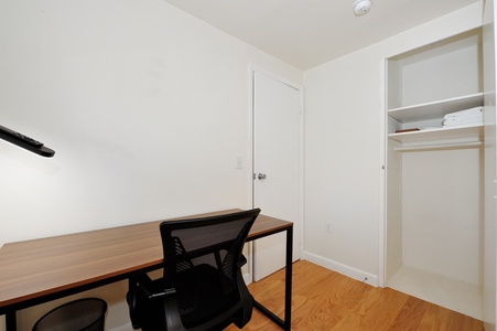 Your dedicated workspace features a sleek desk and ergonomic chair, perfect for staying productive during your stay.