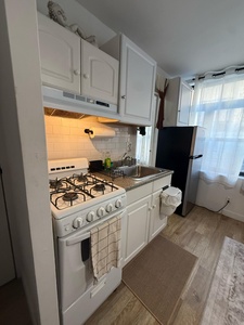 Your fully-equipped kitchen awaits with a gas stove, microwave, and all essentials for preparing delicious homemade meals during your stay.