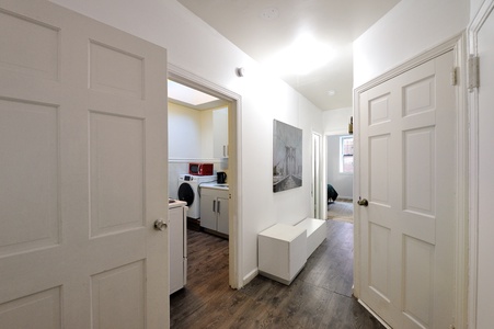Your bright, modern hallway connects all living spaces with thoughtful storage and convenient laundry access.