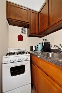 Your fully equipped kitchen features warm wood cabinets, granite counters, and everything you need to cook delicious meals during your stay.