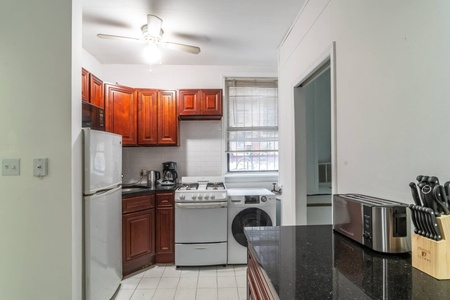 Your fully equipped kitchen features rich cherry cabinets, granite counters, and everything you need to prepare home-cooked meals during your stay.