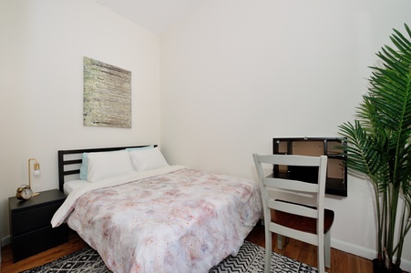 Unwind in your serene bedroom featuring crisp linens, warm wood floors, and natural touches that create the perfect restful retreat.